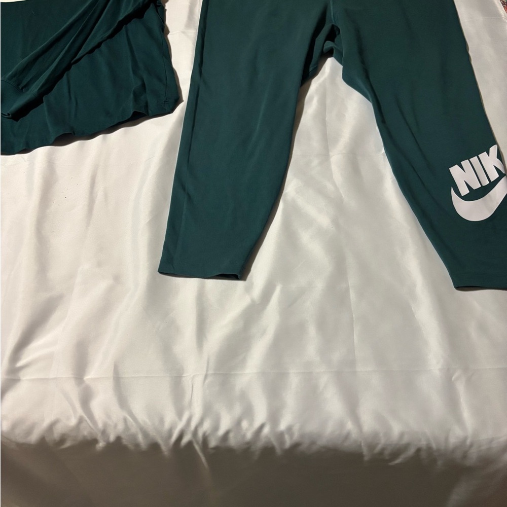 Women green Nike leggings and long sleeve shirt